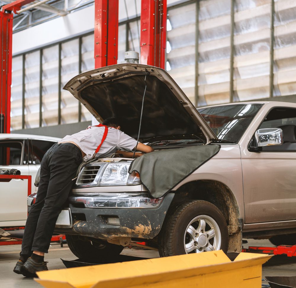 mechanic-working-car-maintenance-with-soft-focus-img